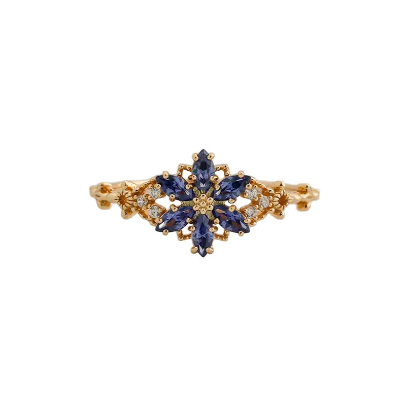 jewelry_925gold_blue-prong_HighCarbonDiamond-IceFlowerCut-frontview.jpg