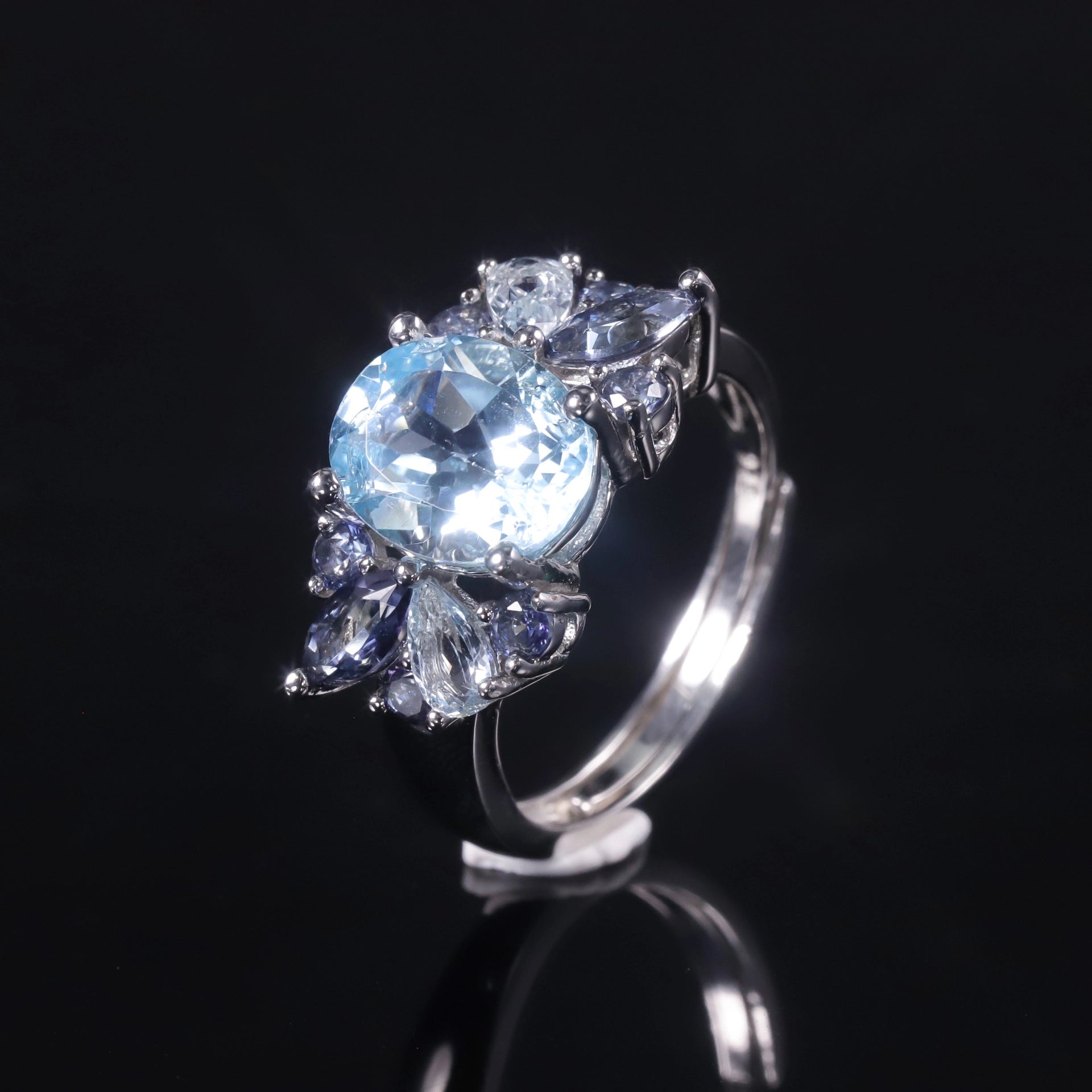jewelry_925silver-Blue-Oval-prong-Topaz-IceFlowerCut-sideview.jpg