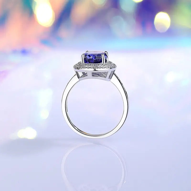 jewelry_925silver-Oval-green-prong-Tanzanite-IceFlowerCut-SideView_4b77c4dd-a238-40da-b02c-16723e44c774.jpg