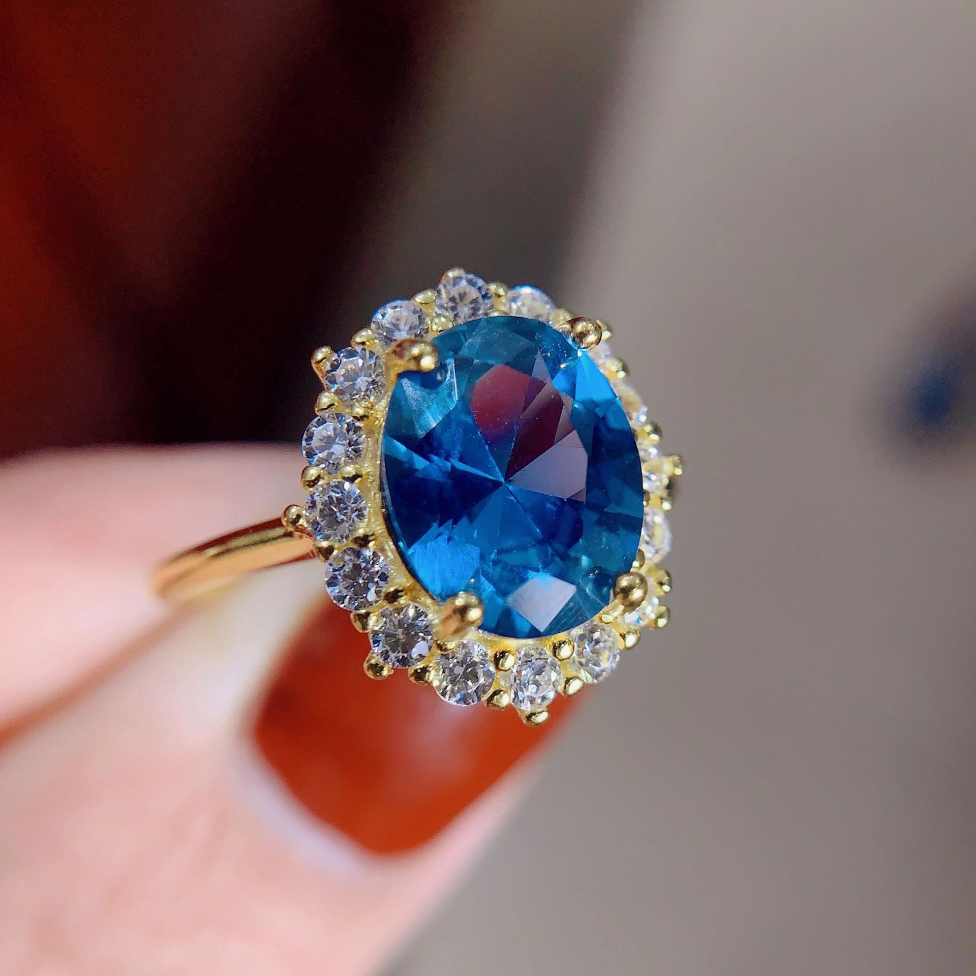jewelry_925silver-blue-Oval-prong-Topaz-SapphireCut-sideview.jpg