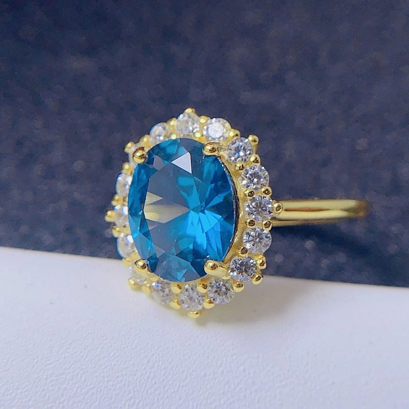 jewelry_925silver-blue_Oval_prong-Topaz-SapphireCut-sideview.jpg
